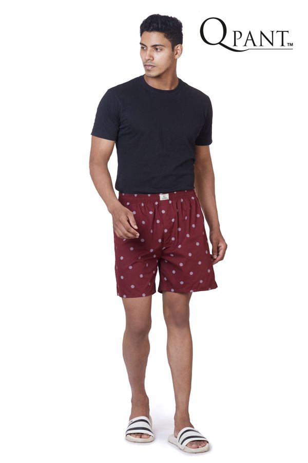 Model in maroon printed boxer shorts